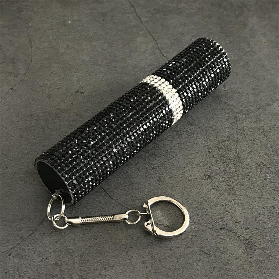Black rhinestone mini stun gun keychain showing clasp and crystal band detail