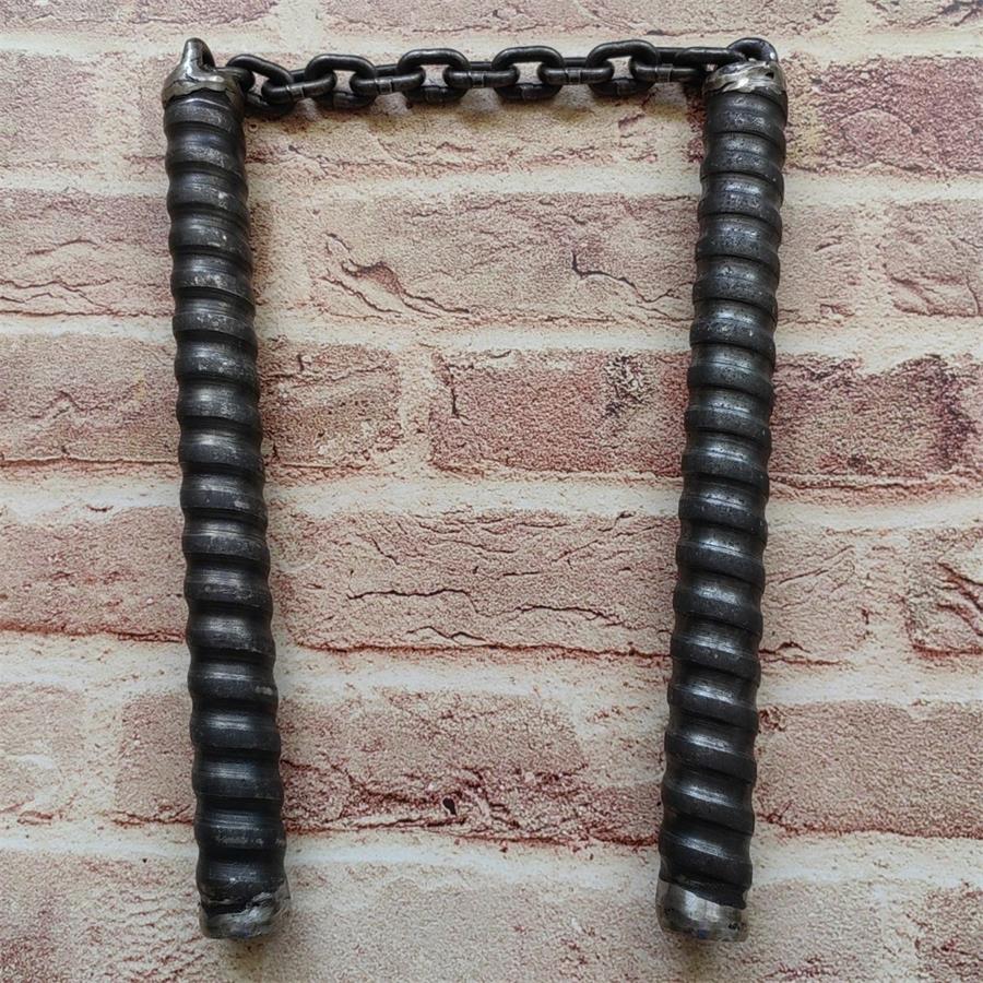 Two black rubber-gripped chain baton handles hanging side by side from metal chain