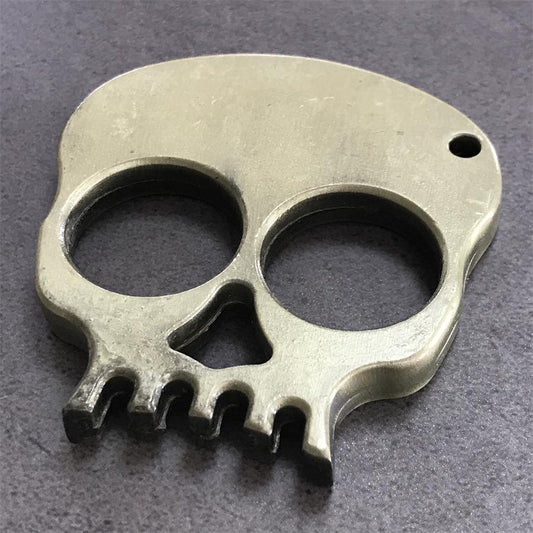 Skull Two-Finger Knuckle Duster flat on stone