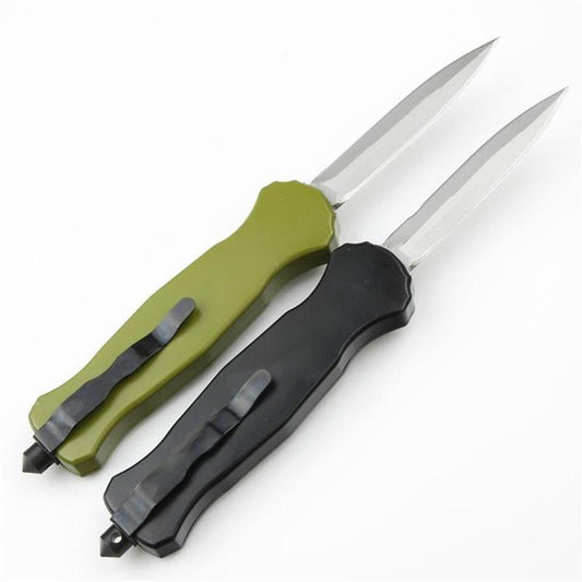Green and black BM 3300 pocket knives showing back side with pocket clips