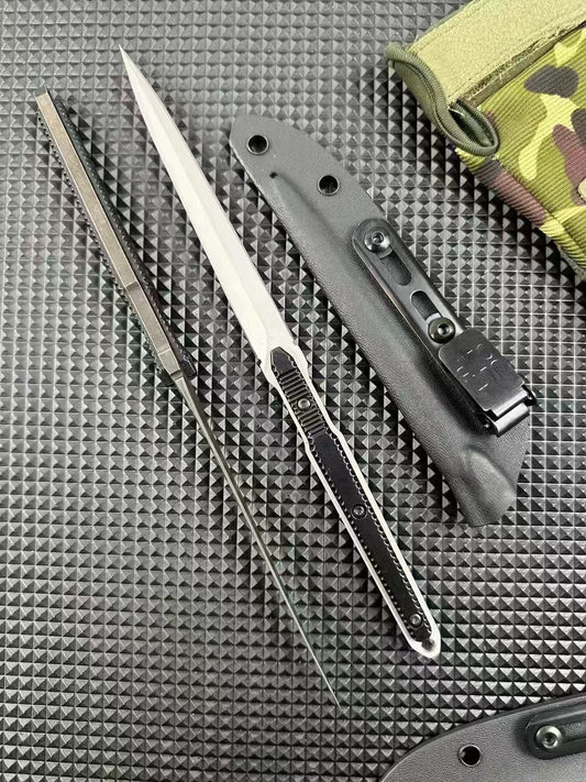 Two bayonets crossed over two black sheaths on textured grey mat