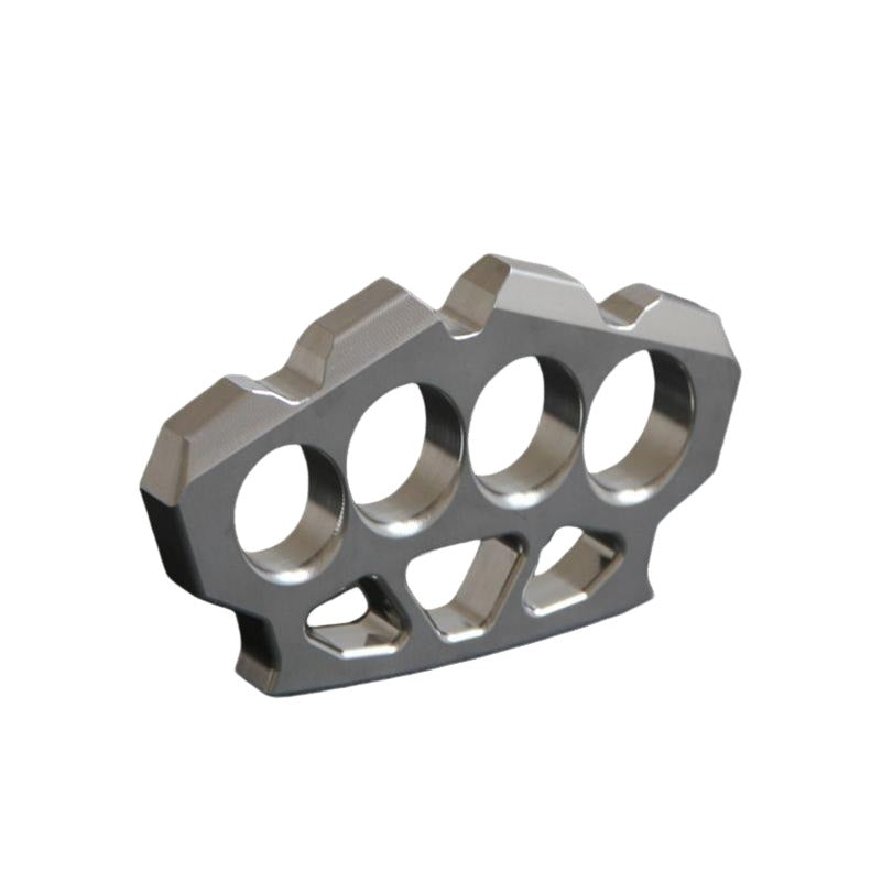 Three-quarter view of the maple leaf shaped stainless steel knuckle duster on white background.