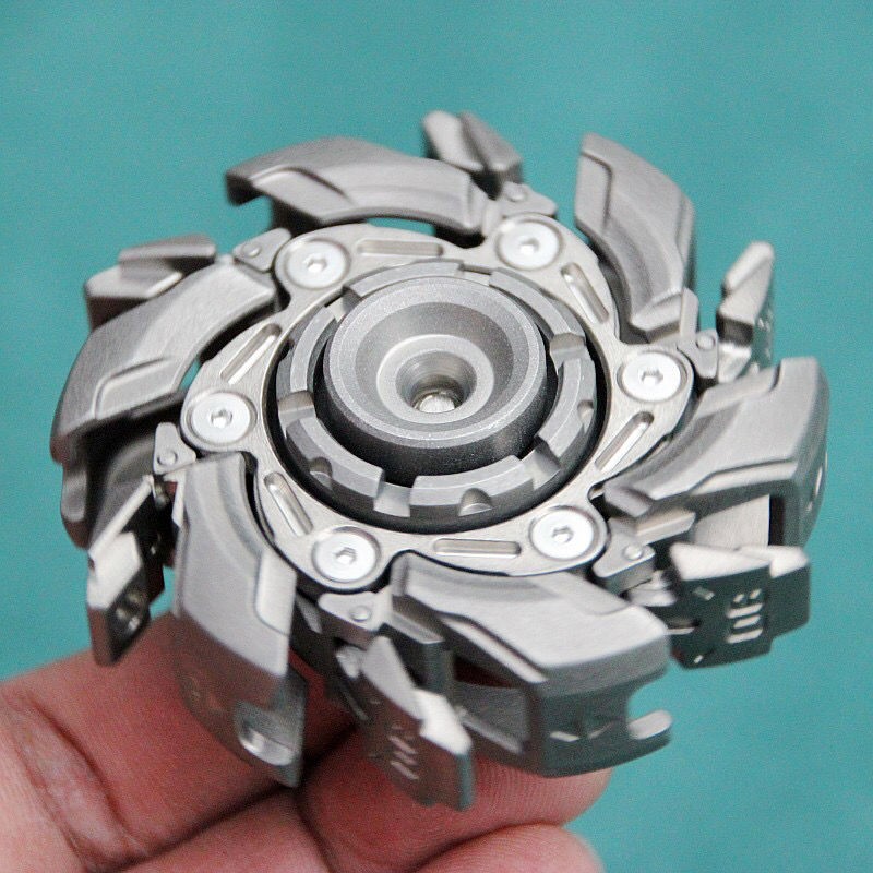 Top-down view of the open metal fidget toy displaying the full open span and jointed layout