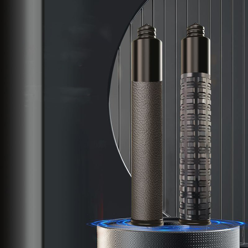 Two collapsed batons standing upright, one leather grip and one tactical grid grip