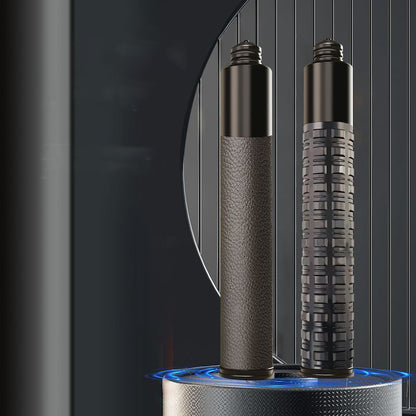 Two collapsed batons standing upright, one leather grip and one tactical grid grip