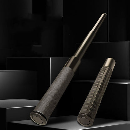 Two telescopic batons on black display blocks, one extended with leather grip and one collapsed with textured grip