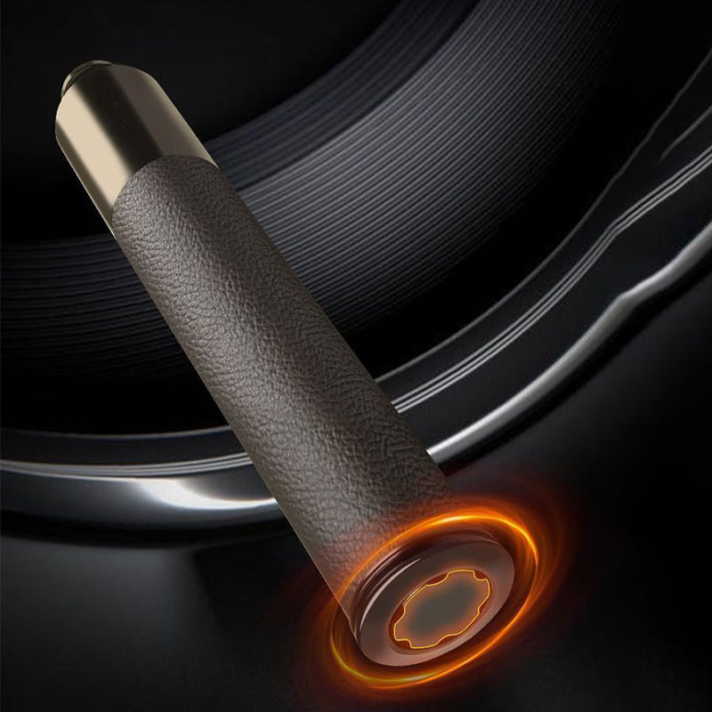 Close-up of baton leather grip with glowing orange window breaker tip detail