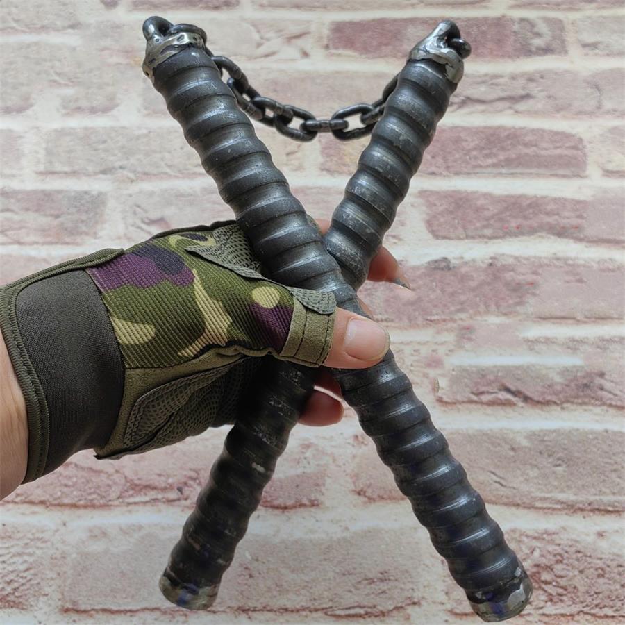 Two black chain baton handles crossed in gloved hand with metal chain link connector