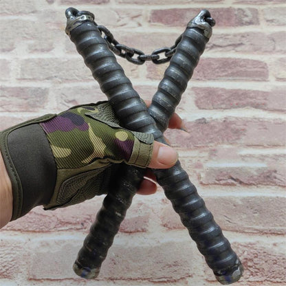 Two black chain baton handles crossed in gloved hand with metal chain link connector