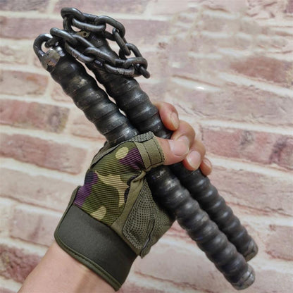 Gloved hand holding two black rubber-gripped chain baton handles connected by metal chain