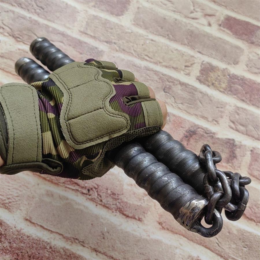 Gloved hand gripping two black ridged baton handles linked by heavy metal chain