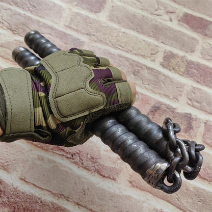 Gloved hand gripping two black ridged baton handles linked by heavy metal chain