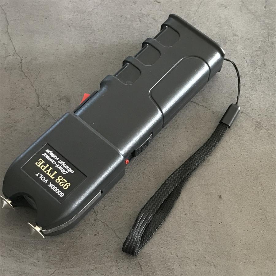 60000K 928 device rear view with wrist lanyard attached