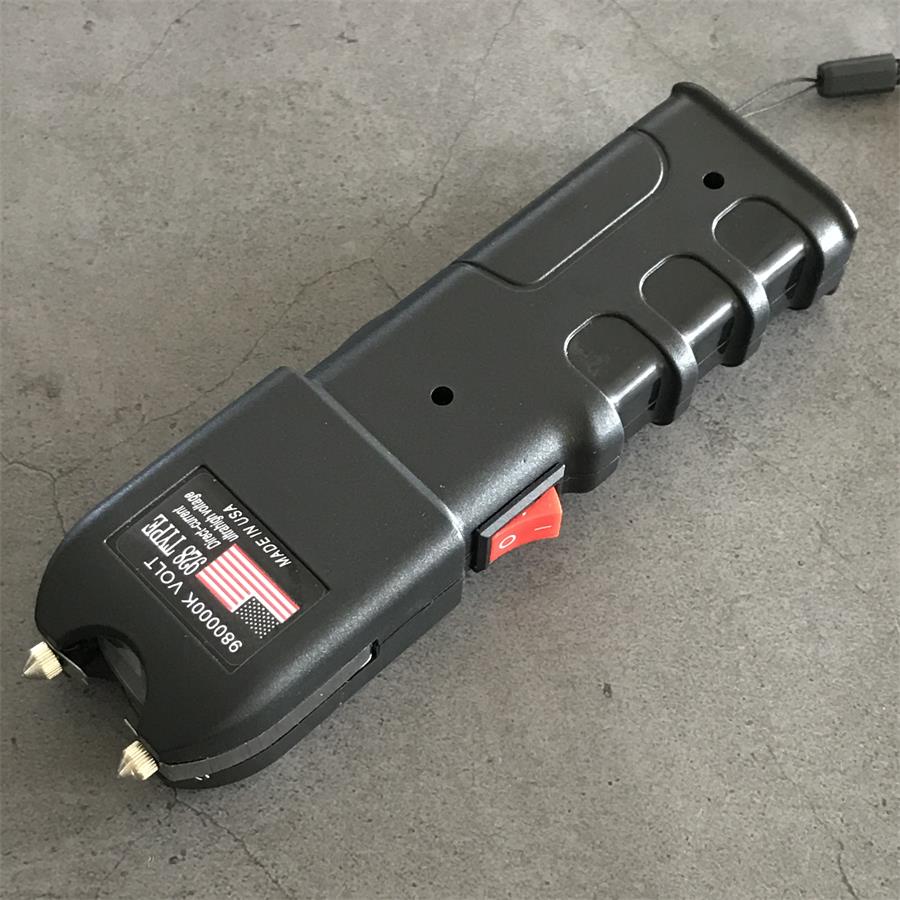 980000K 928 device side view with black lanyard on concrete