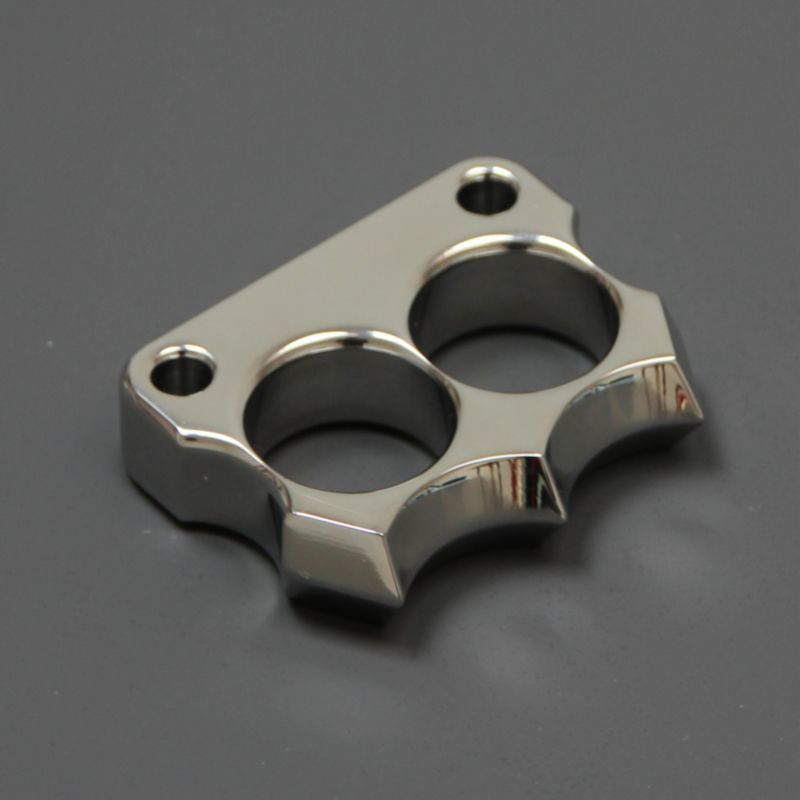 Angled close-up of the mirror polished 316 steel two-hole mini duster on dark grey background.