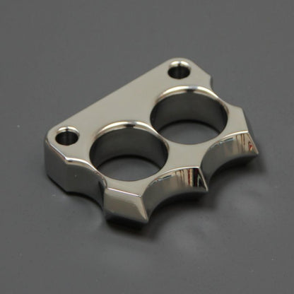 Angled close-up of the mirror polished 316 steel two-hole mini duster on dark grey background.