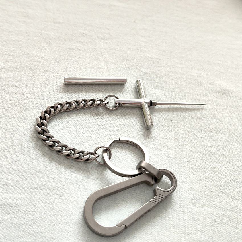 Complete EDC set: 304 steel cross toothpick, protective cap, titanium chain, split rings, and titanium carabiner.