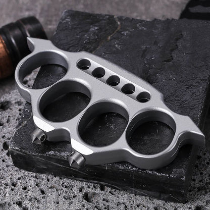 Creative zinc alloy knuckle duster on textured surface
