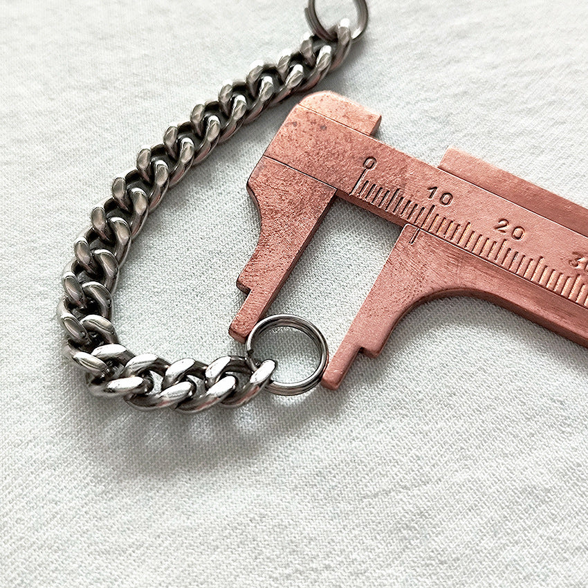 Another scale reference shot of the 304 steel cross toothpick with titanium chain.