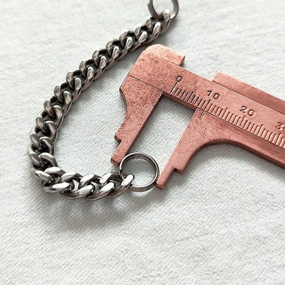 Another scale reference shot of the 304 steel cross toothpick with titanium chain.