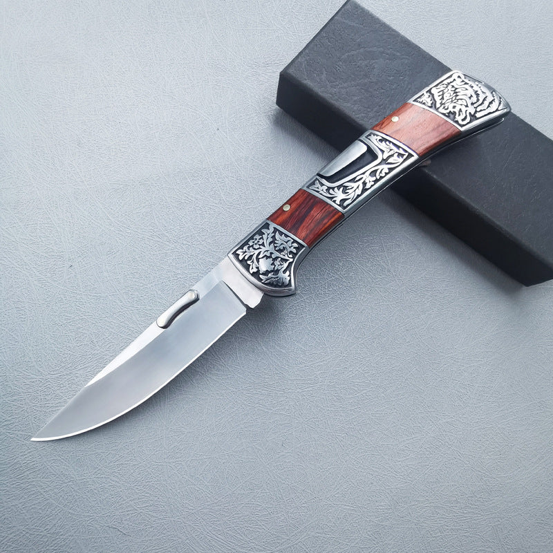 Carved folding knife side