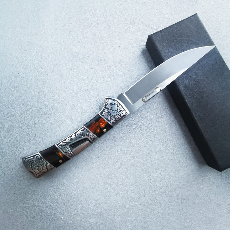 Carved folding knife profile