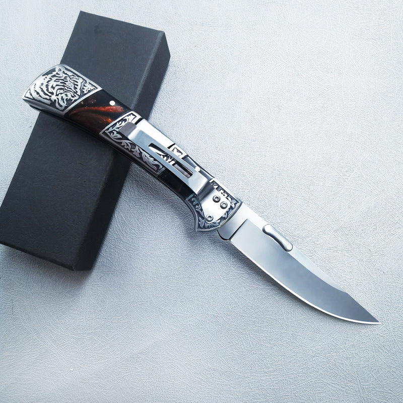 Carved folding knife open