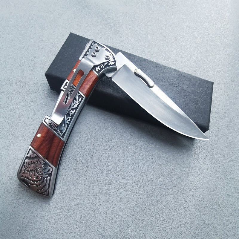 Carved folding knife closed