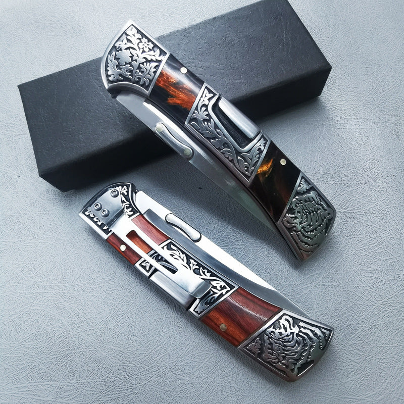 Carved folding knife folded