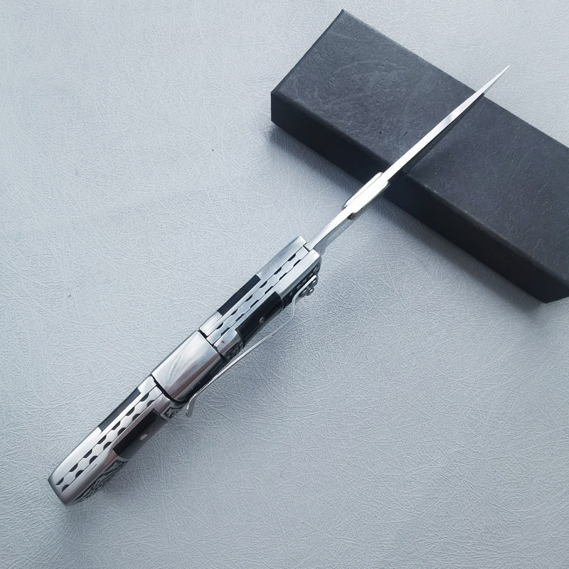 Carved folding knife upright