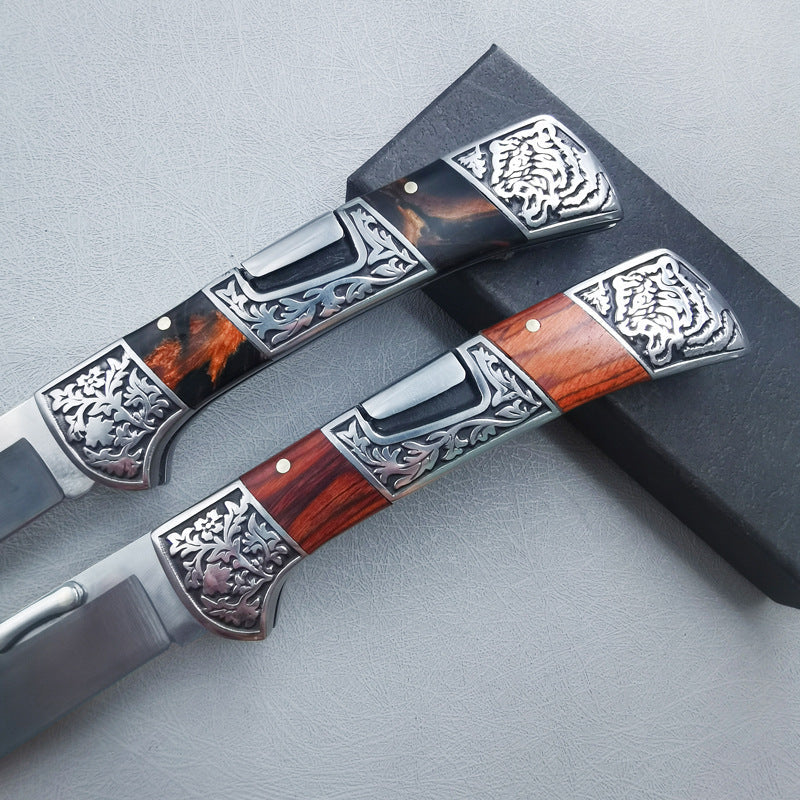 Carved folding knife closeup