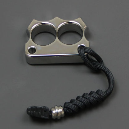Front view of the mirror polished 316 steel two-hole mini duster with the black paracord lanyard attached.