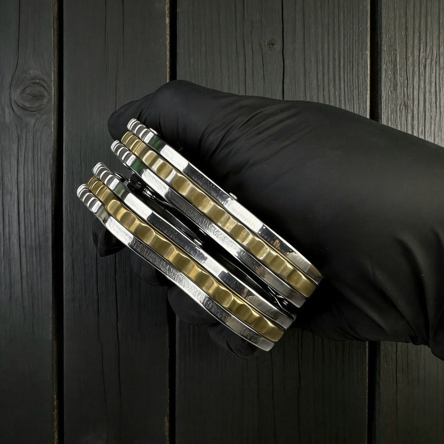 Patterned Mini Knuckle Knife held by black glove