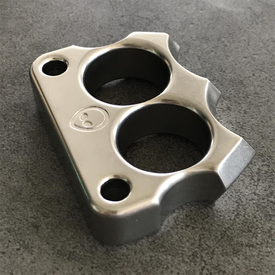 Mini 316 Steel Alien Knuckle Duster angled stone