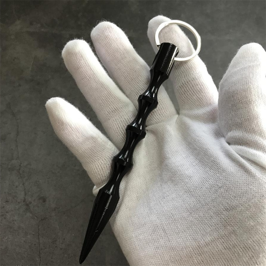 Black EDC baton hand