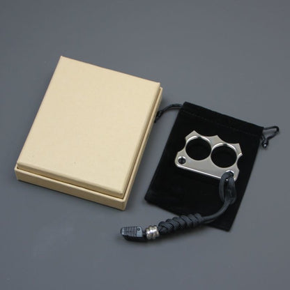 316 steel two-hole mini duster with lanyard placed on a black velvet pouch beside a beige gift box.