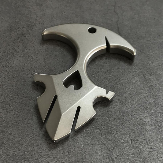 TC21 titanium knuckle duster on grey surface