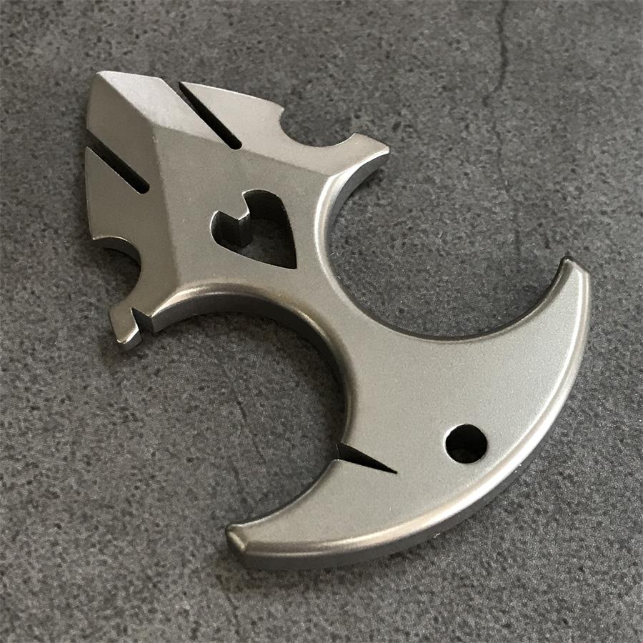 TC21 titanium knuckle duster resting on grey