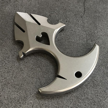 TC21 titanium knuckle duster resting on grey