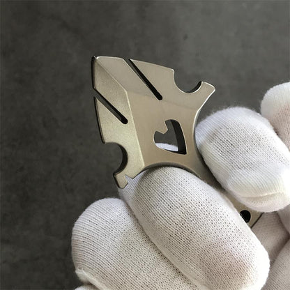 Fingers holding TC21 titanium knuckle duster side