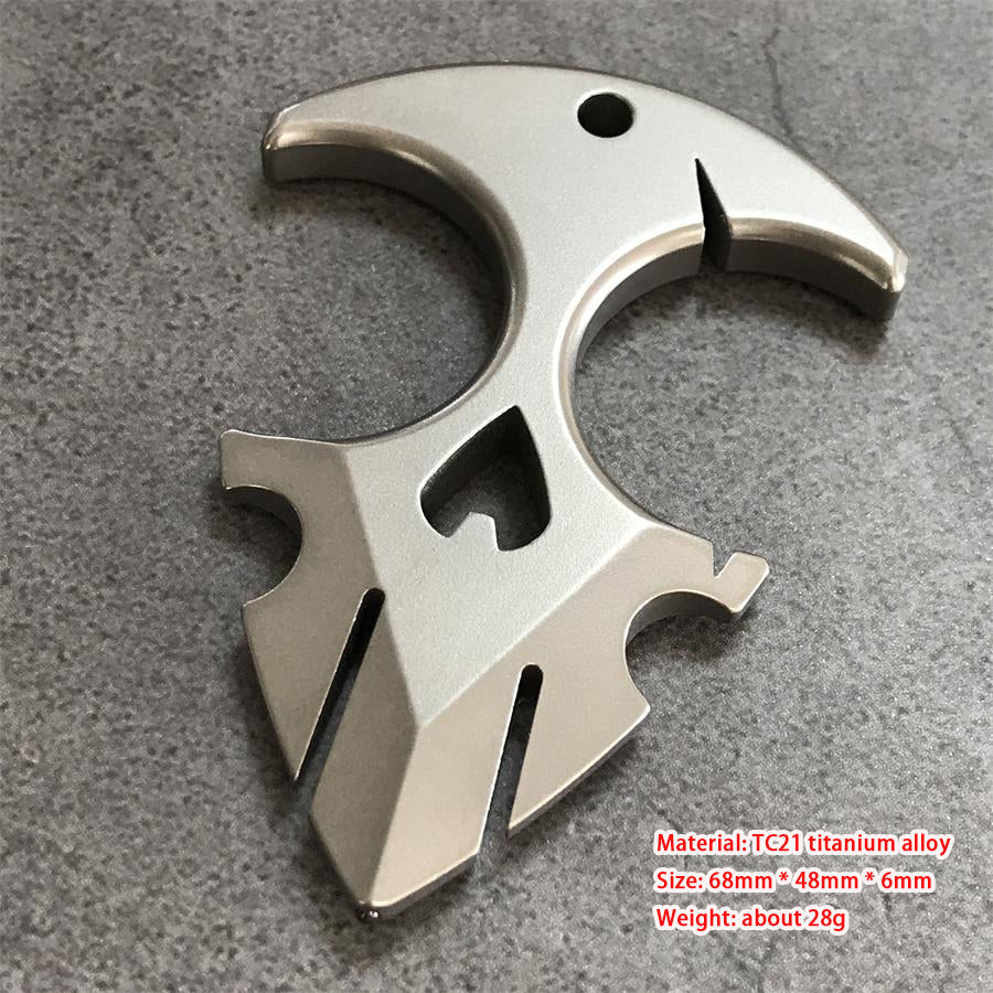 TC21 titanium knuckle duster lying on grey