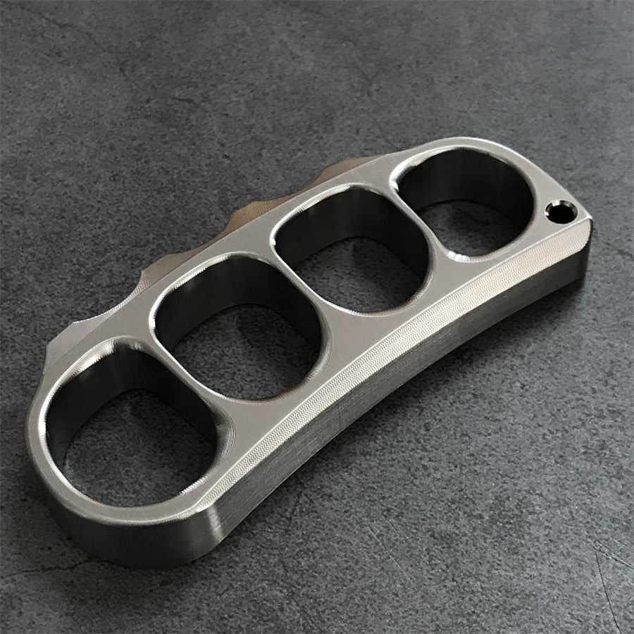Titanium alloy knuckle duster displayed flat
