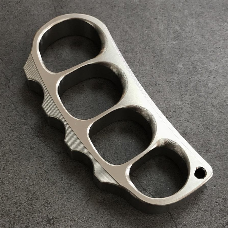 Titanium knuckle duster angled on white