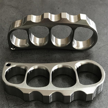 Two titanium knuckle dusters placed vertically