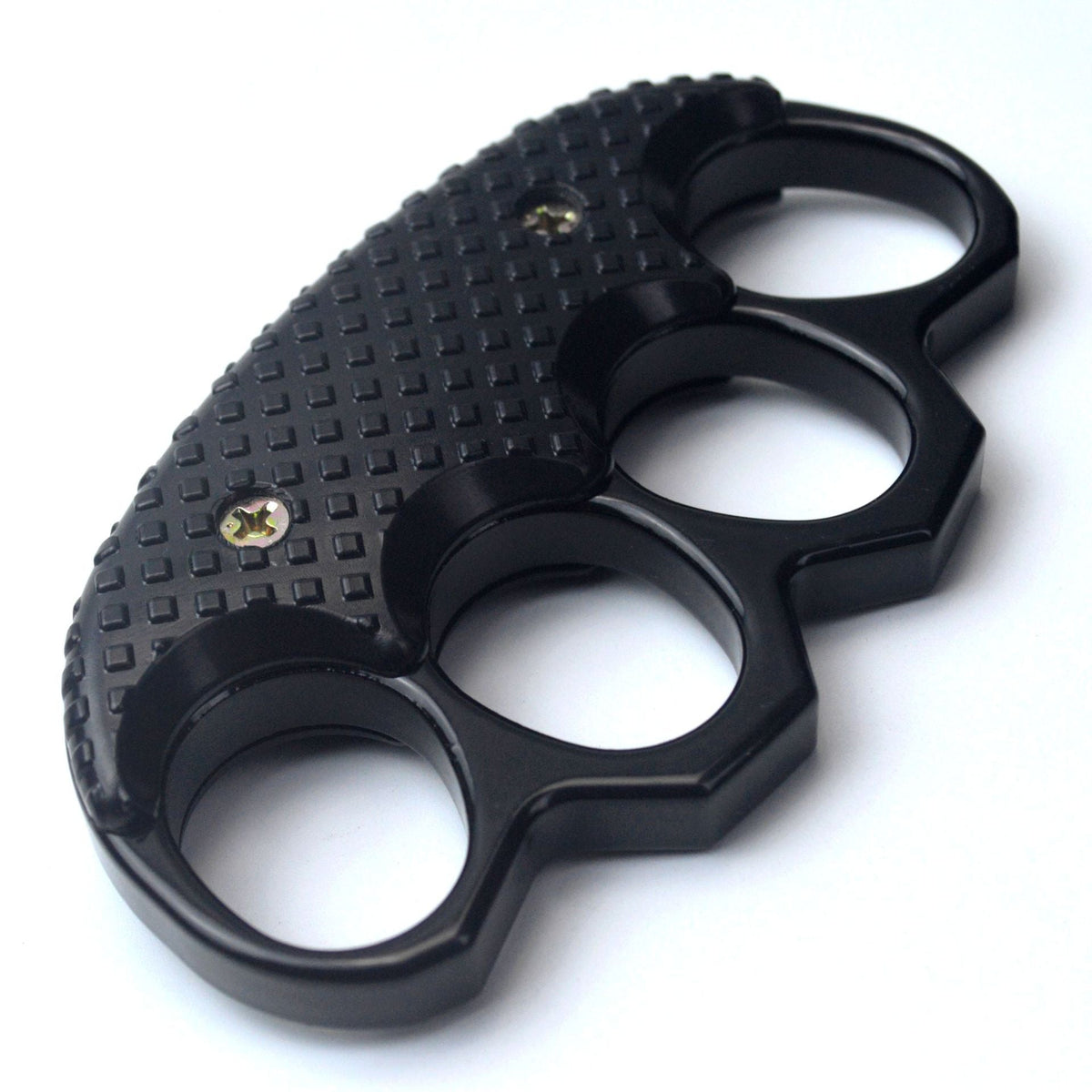 All black knuckle duster on a plain white background with the studded grip panel and four oval finger holes in clear view