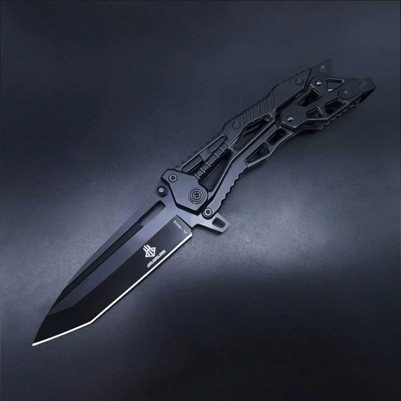 All-black all-steel folding knife open on dark background