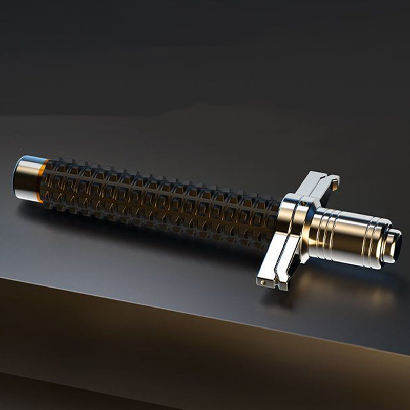Collapsed aviation alloy steel baton lying on a dark surface showing textured grip and guard