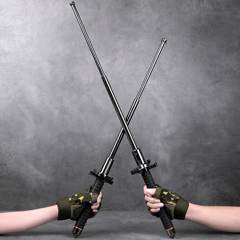 Two gloved hands holding crossed extended aviation alloy steel batons
