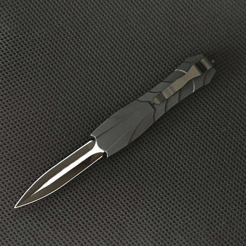 Black tactical OTF knife side view with blade extended