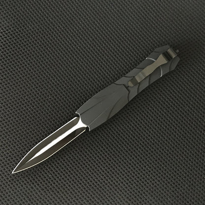 Black tactical OTF knife side view with blade extended